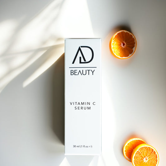 AD BEAUTY Vitamin C Serum Verpackung mit Orangenstücken – Symbolbild für natürliche Vitamin-C-Pflege
